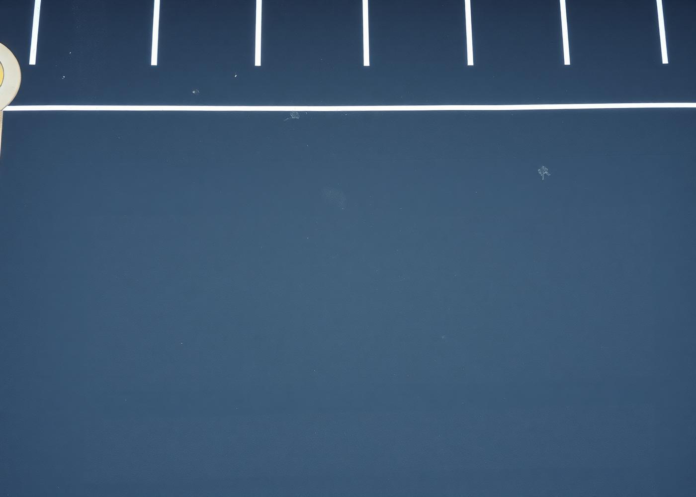 Freshly painted parking bay line markings